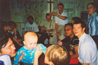 At pastor Valerij's house. It's a very small, one-room house, but there was enough space for everybody. In the front you can see pastor's younger son (10 months)