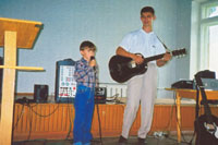 Vitalik, pastor's elder son. He is singing a song about the Holy Spirit